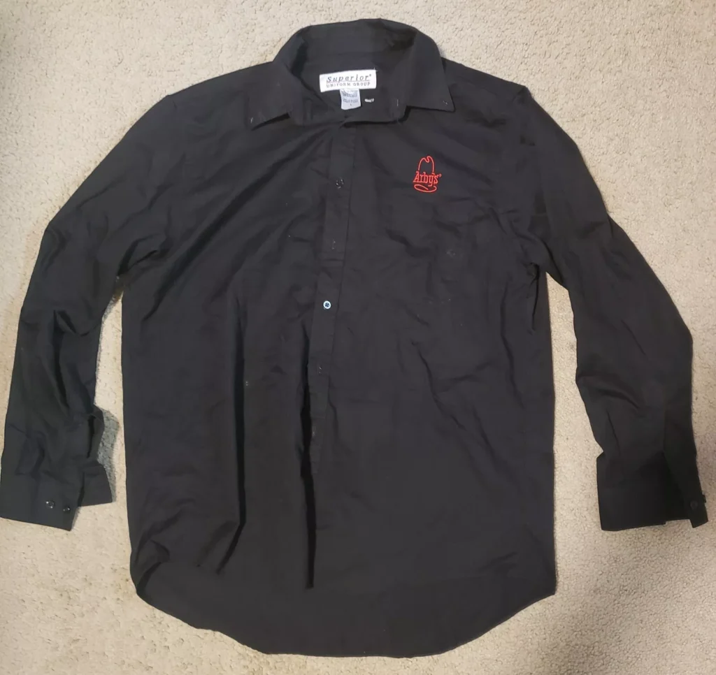 Image of the Arby's Employee Button Down Shirt, highlighting its professional and comfortable design worn by team members.