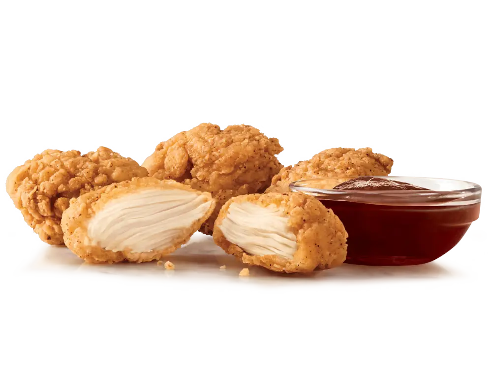 Premium 4PC Chicken Nuggets, crispy and tender, ready for dipping.